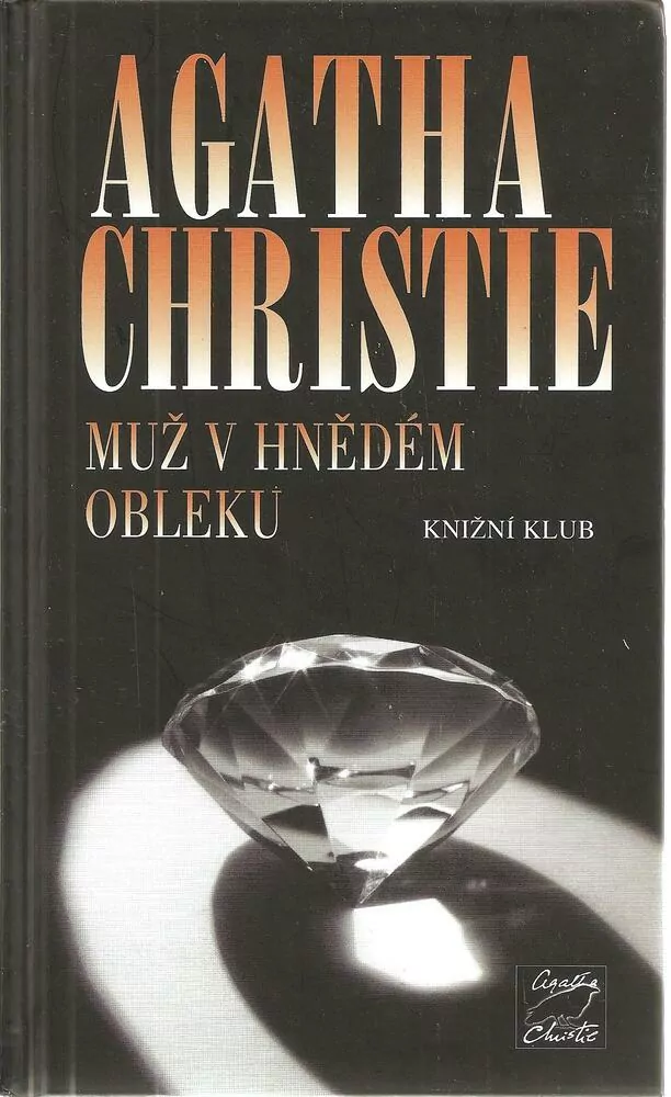 Muž v hnědém obleku